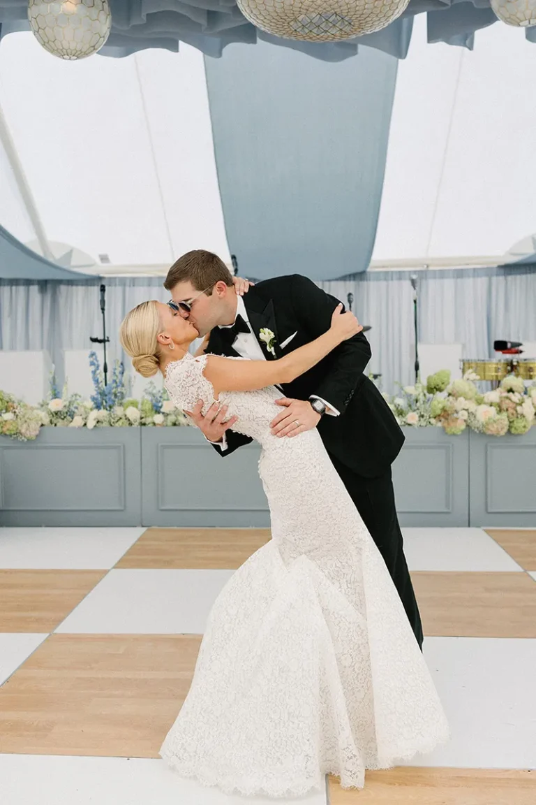 wedding couple kissing on dance floor at bachelor gulch venue